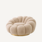 Fauteuil pivotant en tissu molletonné sable